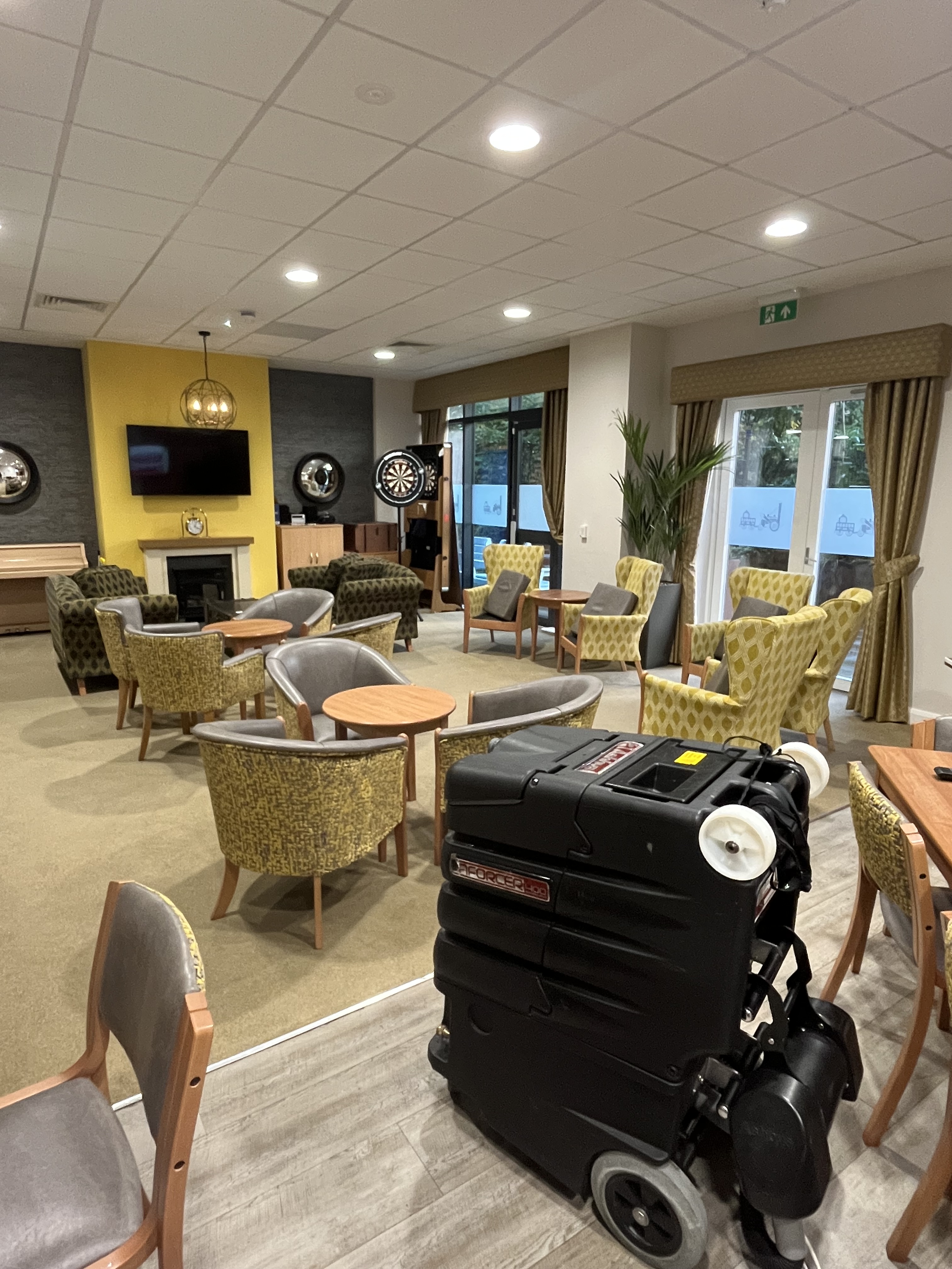 Commercial carpet and upholstery cleaning in a care home lounge by Epic Clean