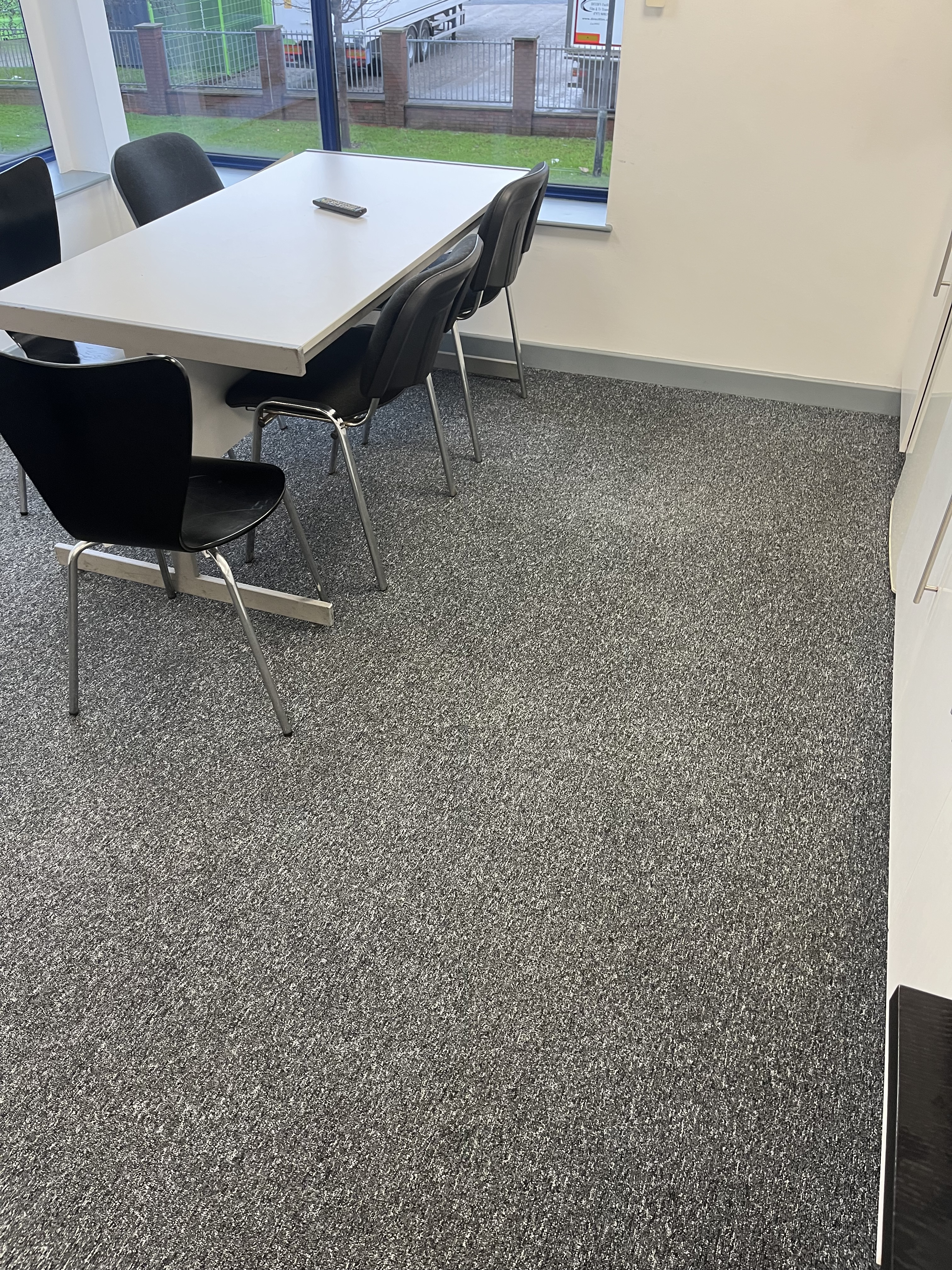 Office carpet cleaning in a meeting room by Epic Clean